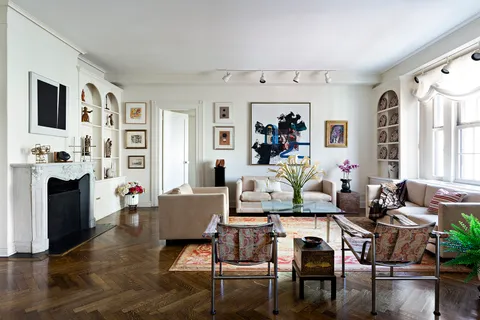 a living room with furniture and fireplace