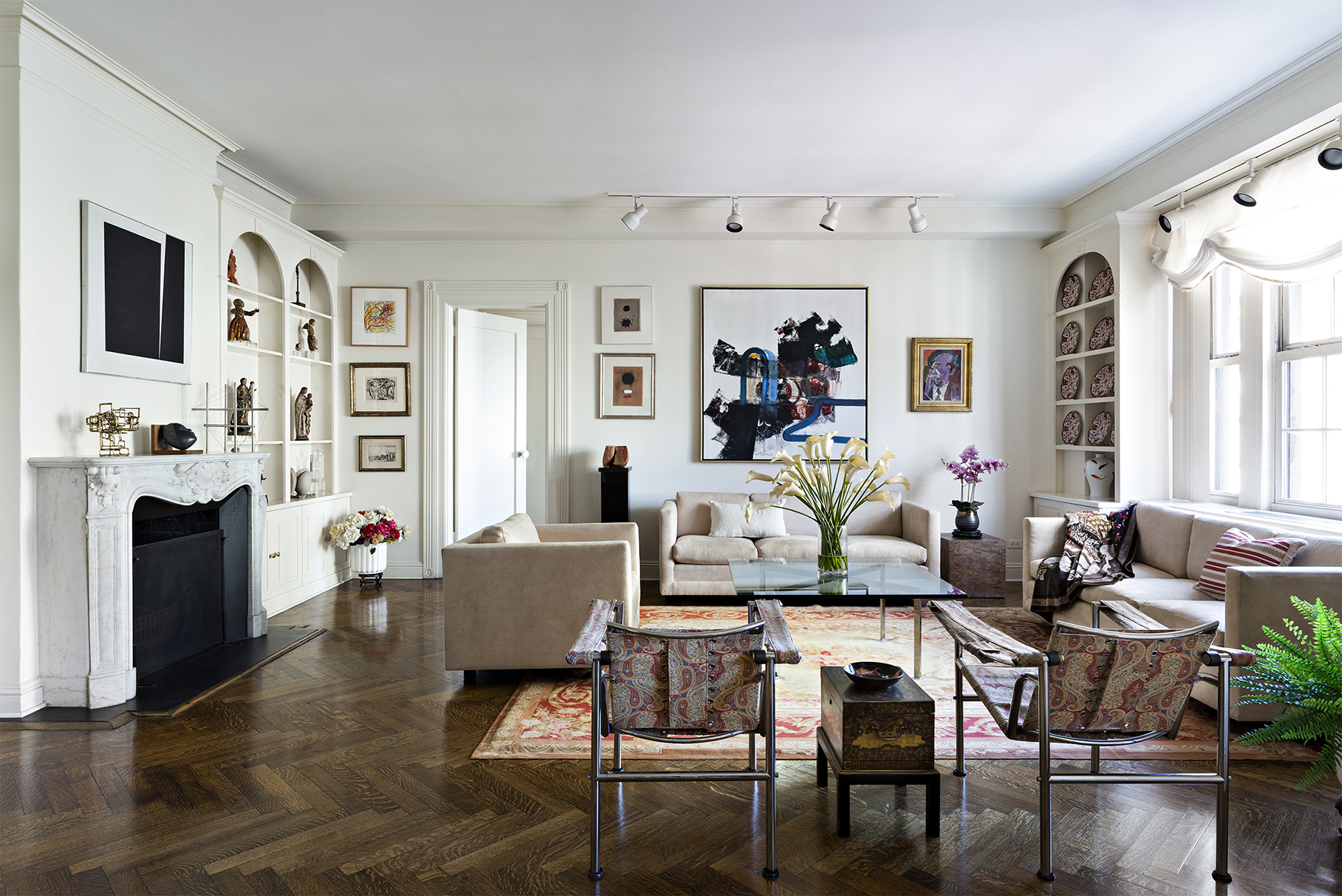 815 Park Avenue, Unit 8A Manhattan, NY 10021 - Photo 3 of 8 a living room with furniture and fireplace