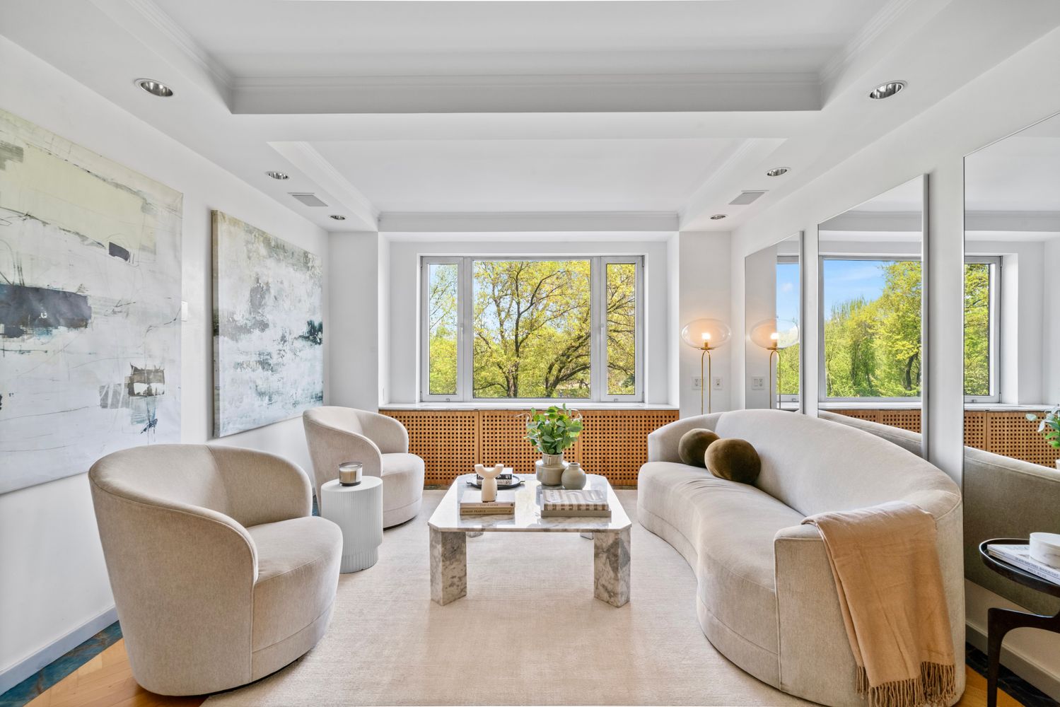 120 Central Park South, Unit 6ABC Manhattan, NY 10019 - Photo 2 of 17 a living room with furniture and a large window