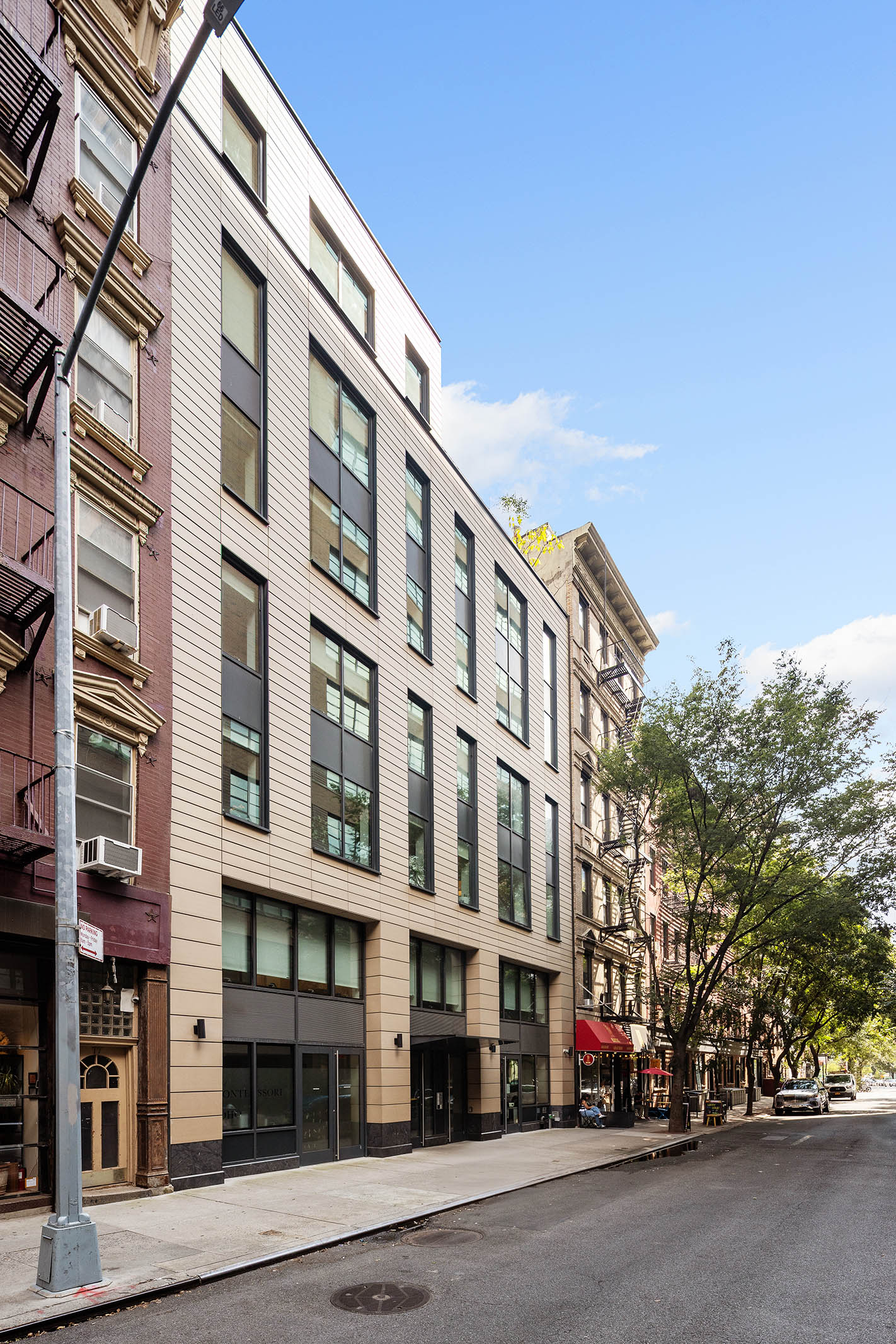 75 Sullivan Street, Unit 5S Manhattan, NY 10012 - Photo 11 of 12 front view of a building with a street