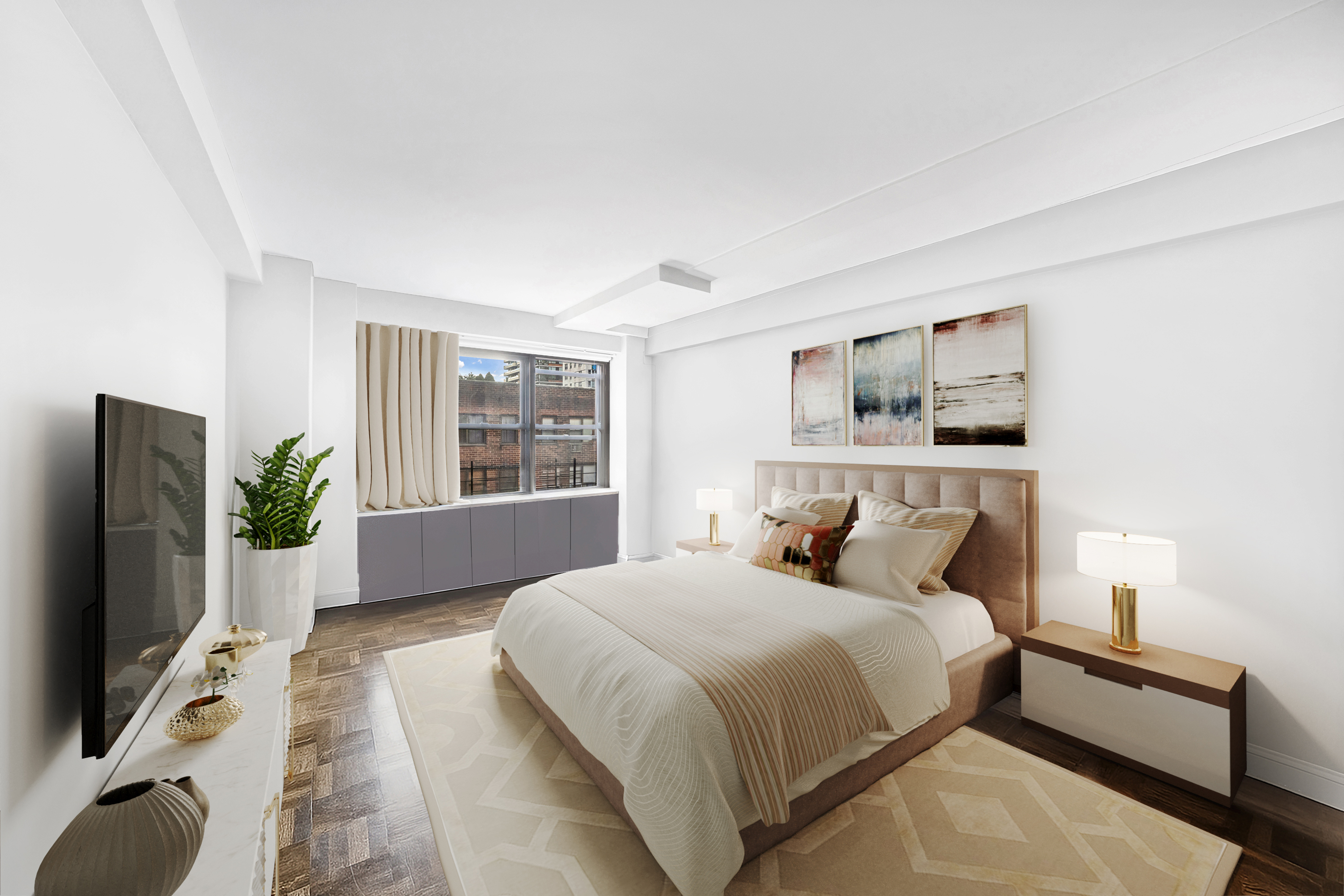 2 Tudor City Place, Unit 11KN Manhattan, NY 10017 - Photo 5 of 14 a bedroom with a bed and a flat screen tv