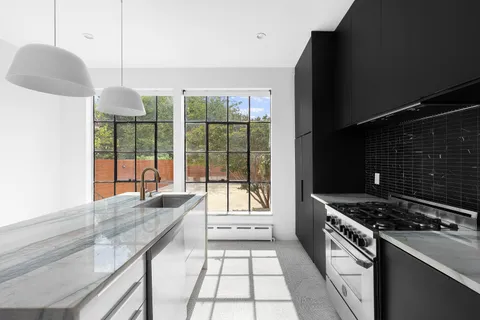 a kitchen with a stove and a white refrigerator