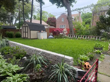 a view of a chair and table in the garden