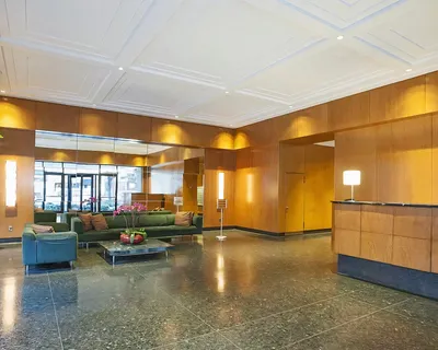 a lobby with furniture and window