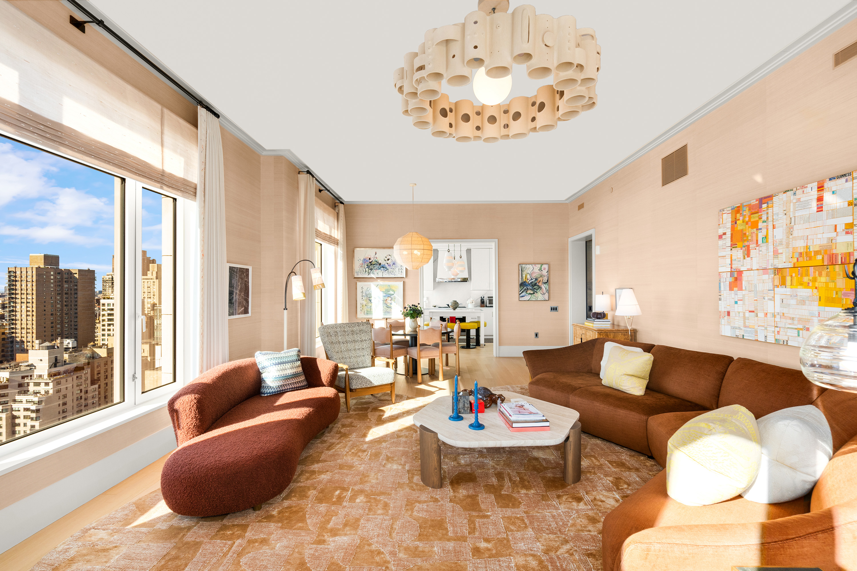 200 East 83rd Street, Unit 24C Manhattan, NY 10028 - Photo 16 of 35 a living room with furniture and a large window