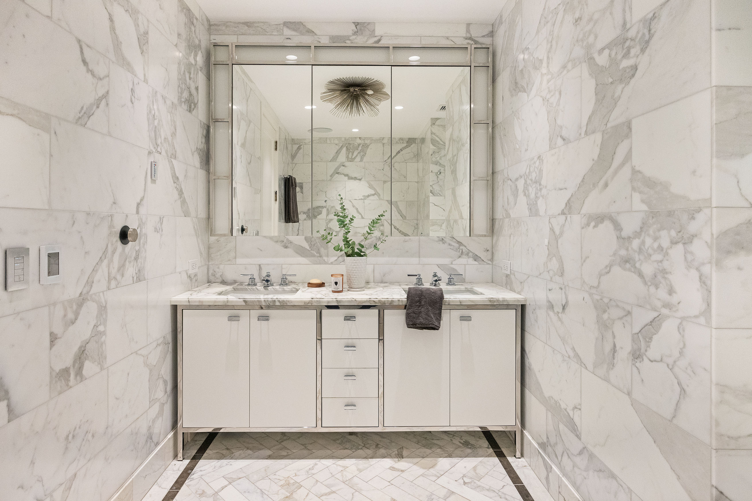 100 Barclay Street, Unit 21AD Manhattan, NY 10007 - Photo 15 of 37 a bathroom with a sink and a mirror