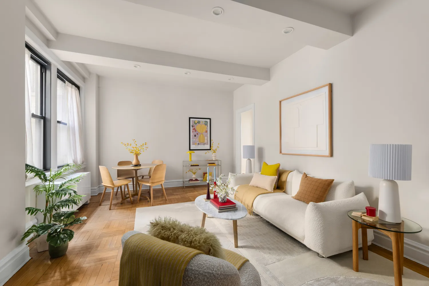 a kitchen with white cabinets and appliances