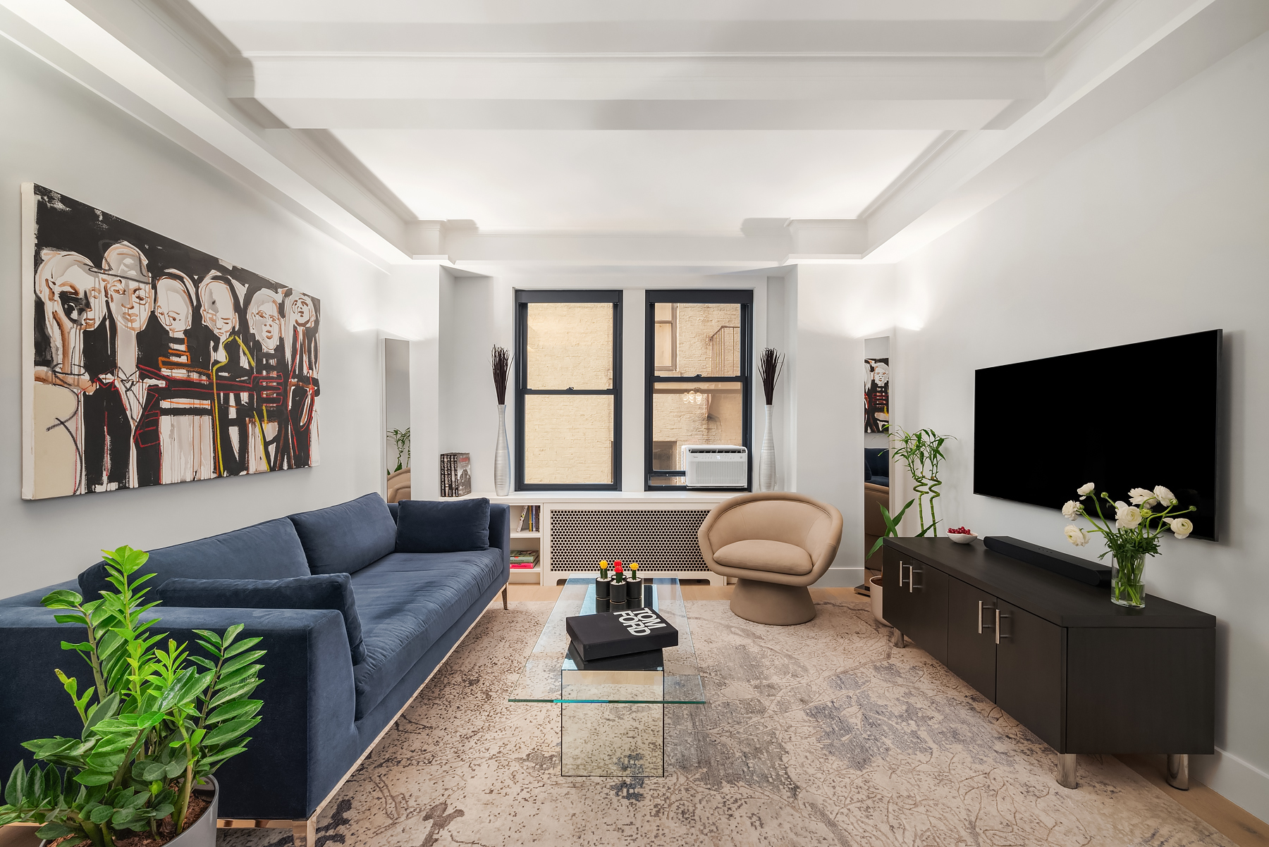 440 West End Avenue, Unit 2E Manhattan, NY 10024 - Photo 5 of 12 a living room with furniture a flat screen tv and a large window