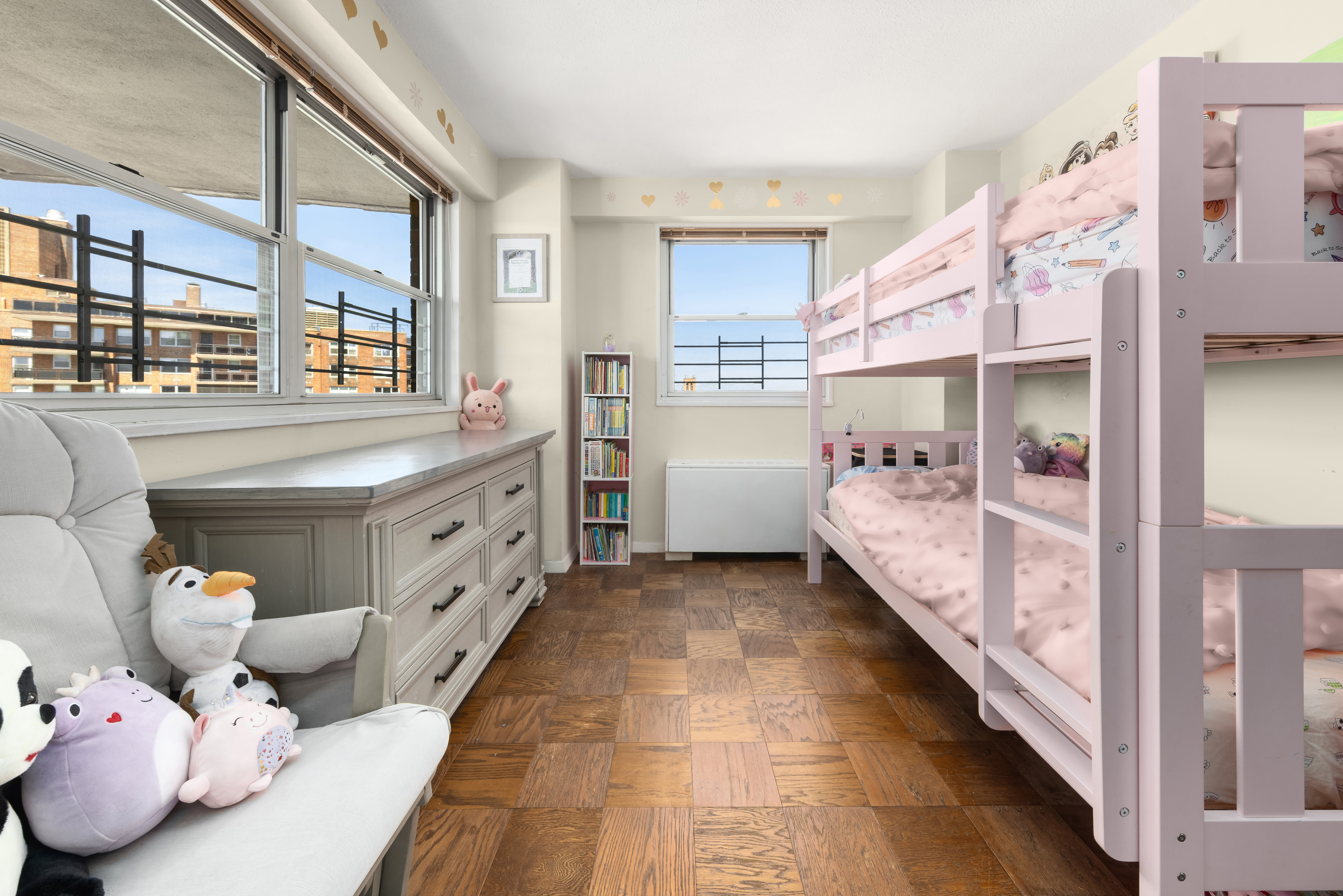 70-31 108th Street, Unit 12D Queens, NY 11375 - Photo 6 of 16 a large kitchen with stainless steel appliances kitchen island granite countertop a refrigerator and a stove