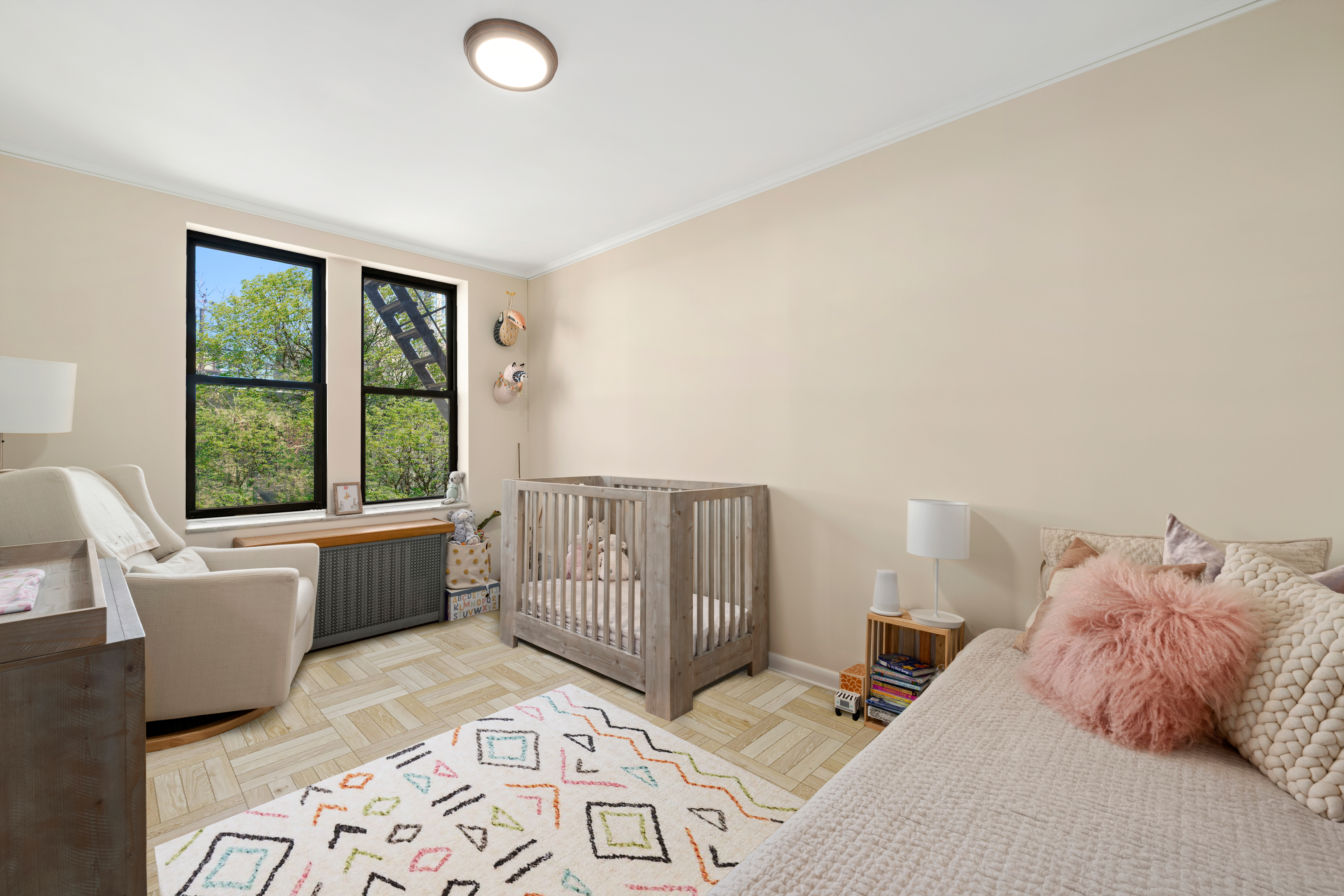 315 East 88th Street, Unit 5E Manhattan, NY 10128 - Photo 5 of 8 a bedroom with a bed and window