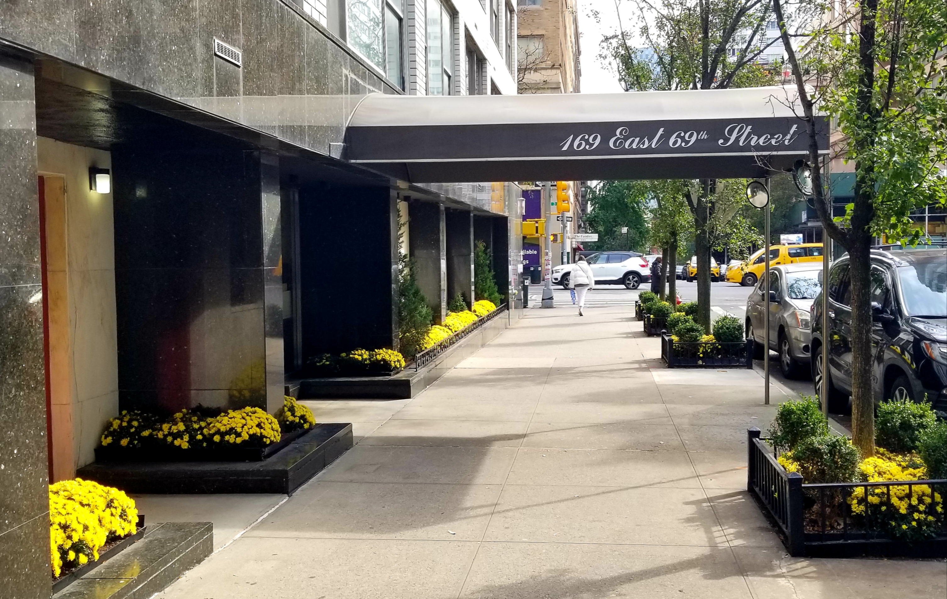 169 East 69th Street, Unit 7/8 B Manhattan, NY 10021 - Photo 21 of 30 a front view of a building with lots of yellow lighting