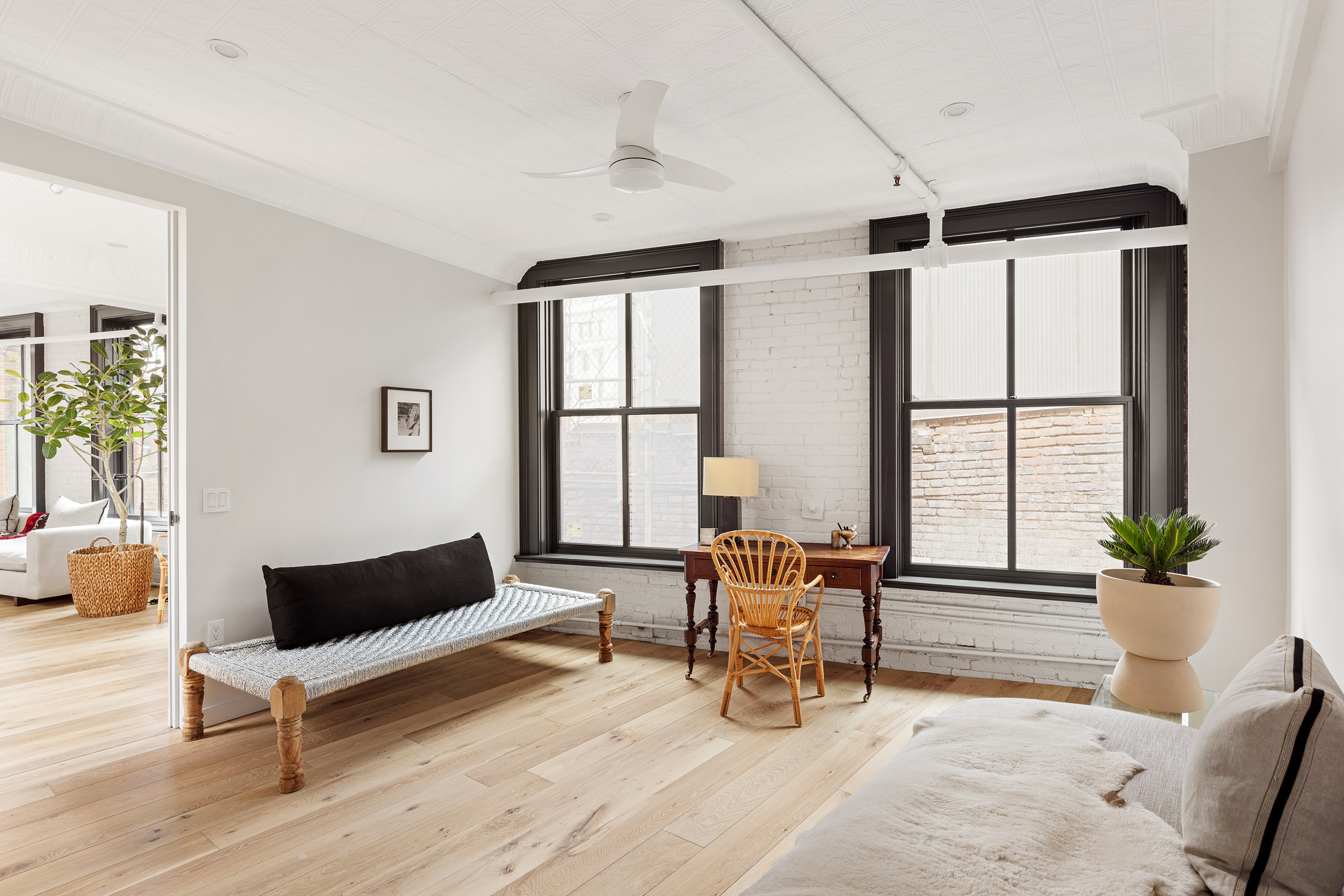 22 East 18th Street, Unit PH6B Manhattan, NY 10003 - Photo 8 of 13 a living room with furniture and wooden floor
