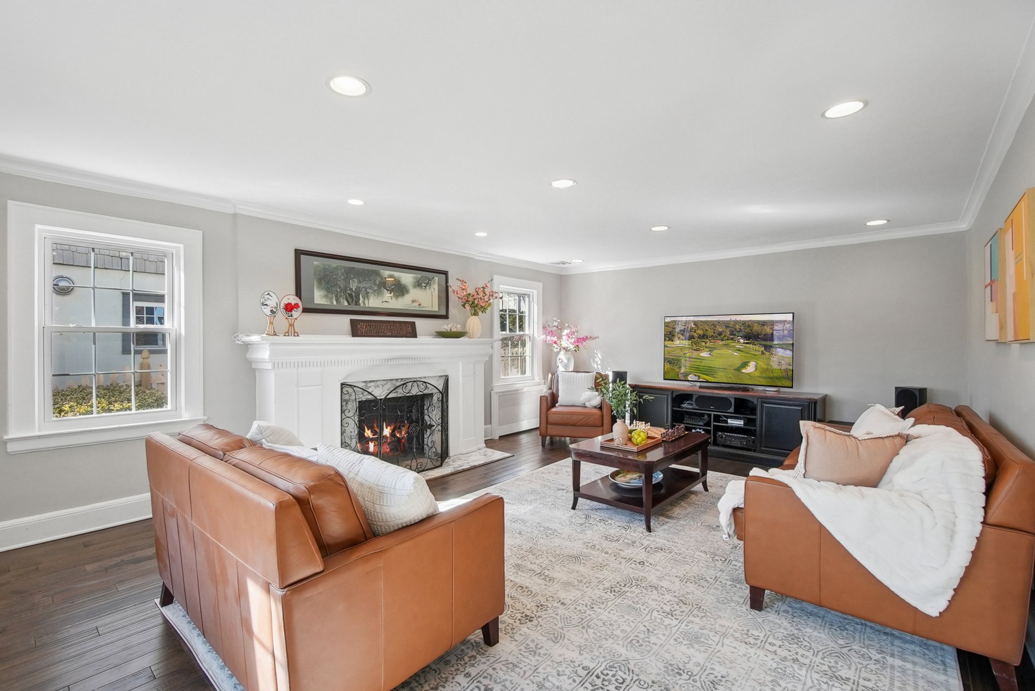 877 Ridgewood Road Millburn, NJ 07041 - Photo 4 of 37 a living room with furniture and a fireplace