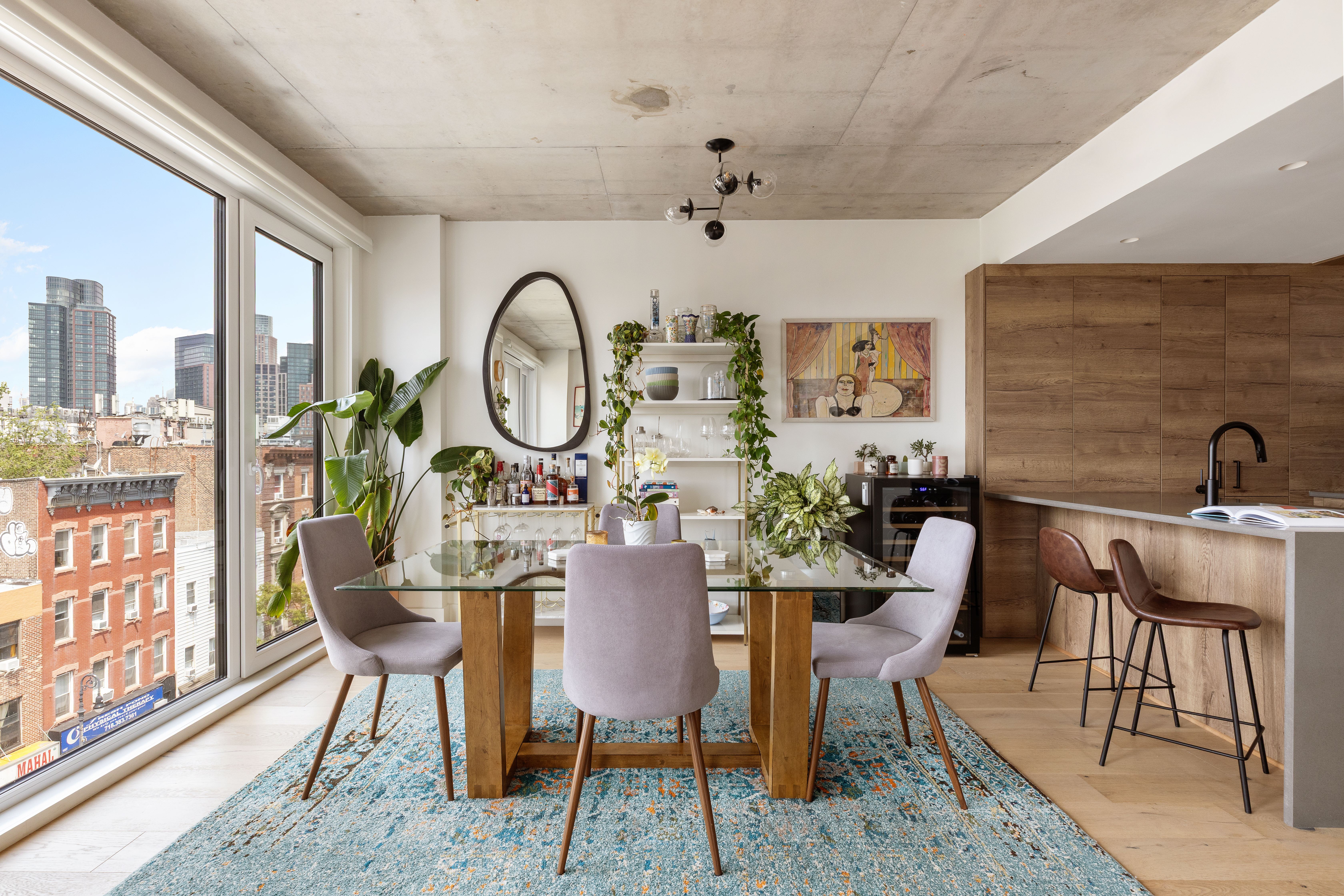 169 Huron Street, Unit PHB Brooklyn, NY 11222 - Photo 3 of 12 a view of a dining room with furniture window and wooden floor