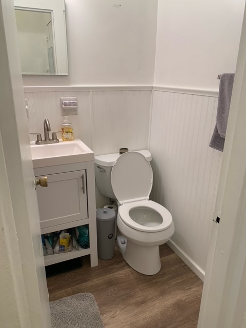 143 Sullivan Street, Unit 12 Manhattan, NY 10012 - Photo 9 of 11 a bathroom with a toilet a sink and a mirror