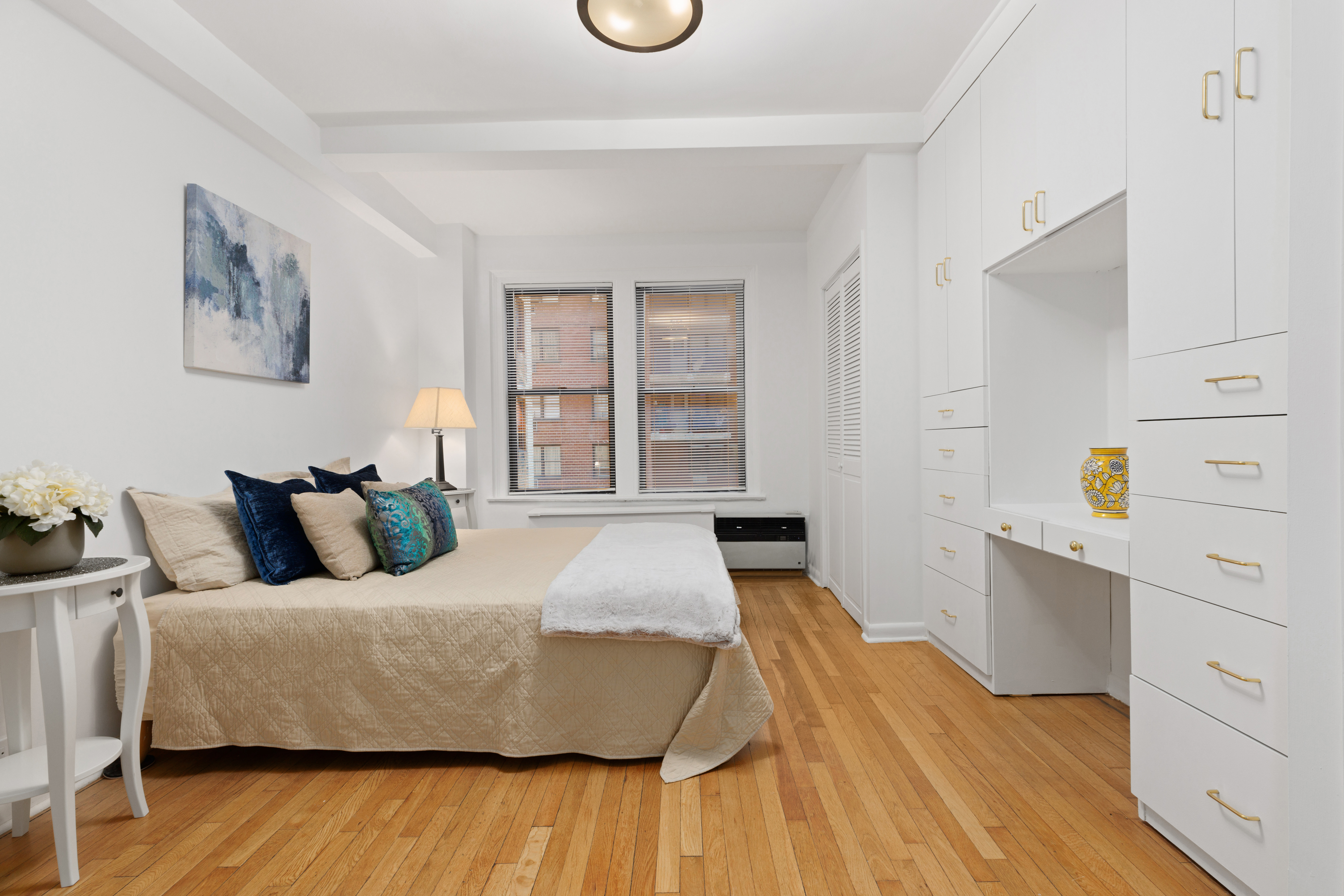 175 West 93rd Street, Unit 3D Manhattan, NY 10025 - Photo 3 of 10 a bedroom with a bed and wooden floor