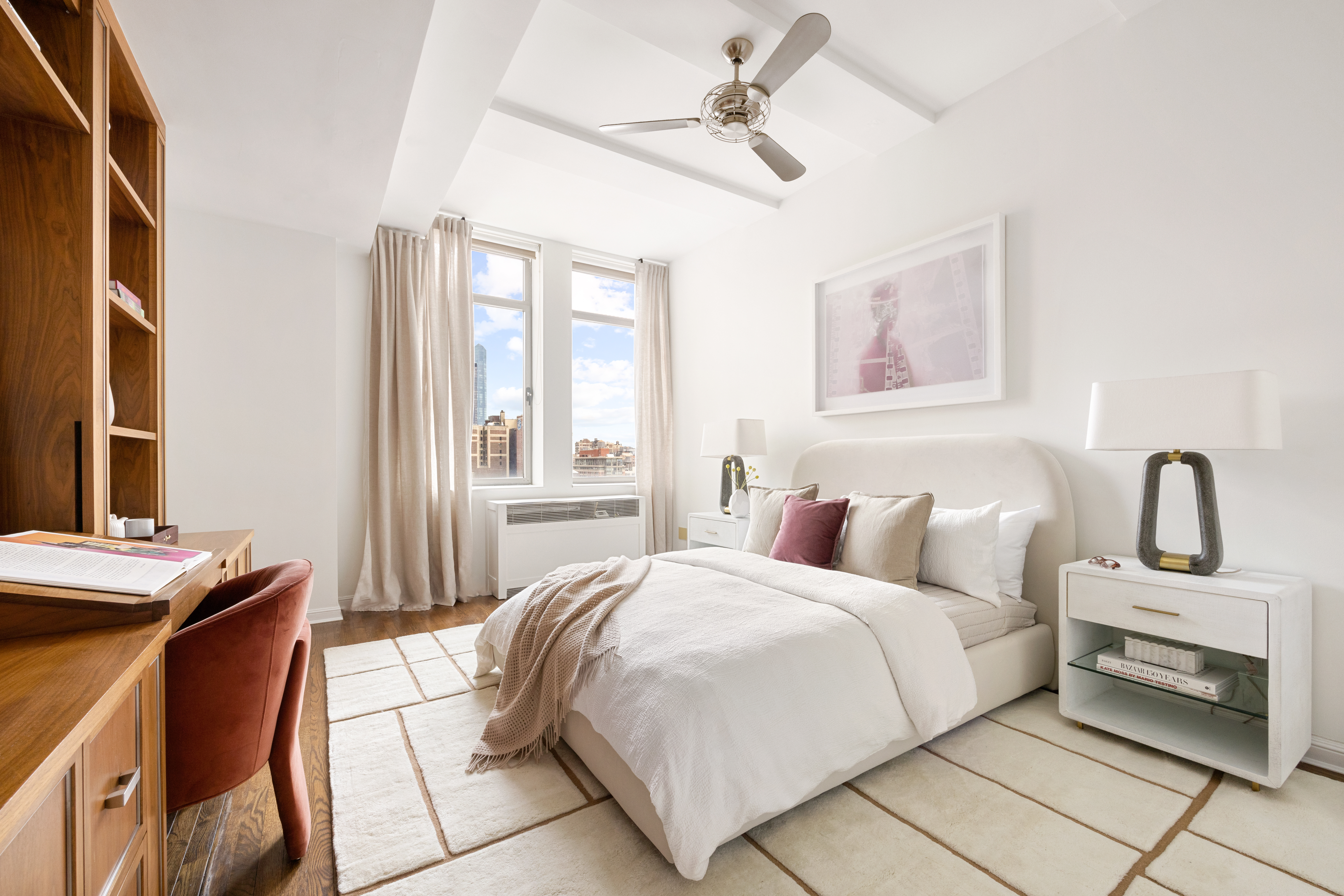 252 7th Avenue, Unit 17I Manhattan, NY 10001 - Photo 14 of 17 a bedroom with a bed and a window