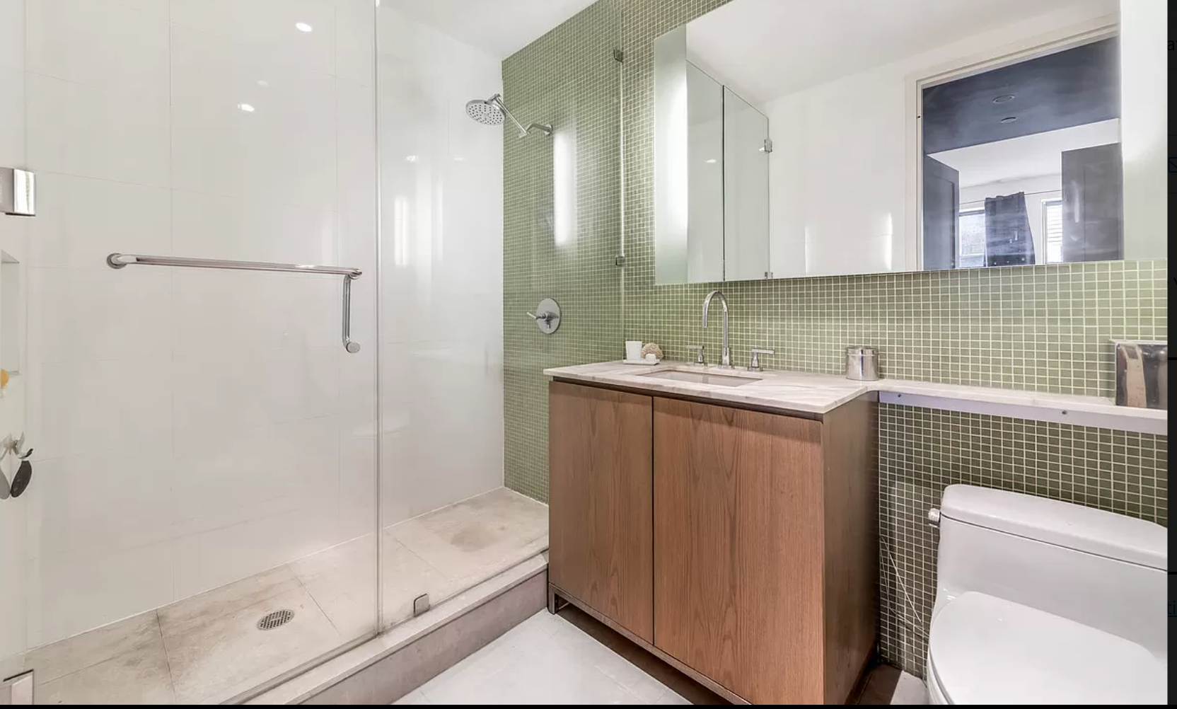71 Nassau Street, Unit 12C Manhattan, NY 10038 - Photo 11 of 18 a bathroom with a sink a toilet and shower