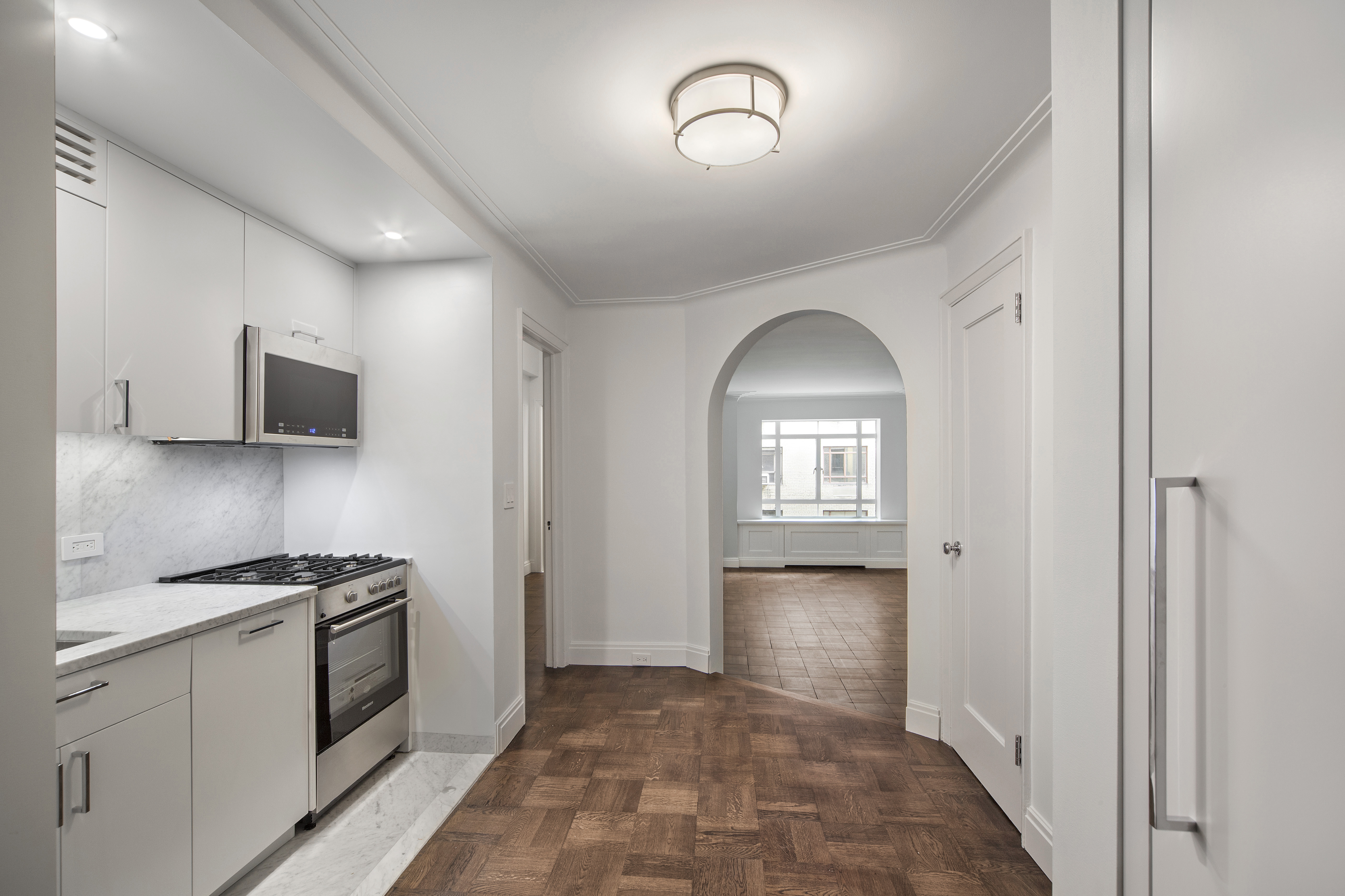25 Central Park West, Unit 4U Manhattan, NY 10023 - Photo 4 of 8 a view of a kitchen cabinets and stainless steel appliances