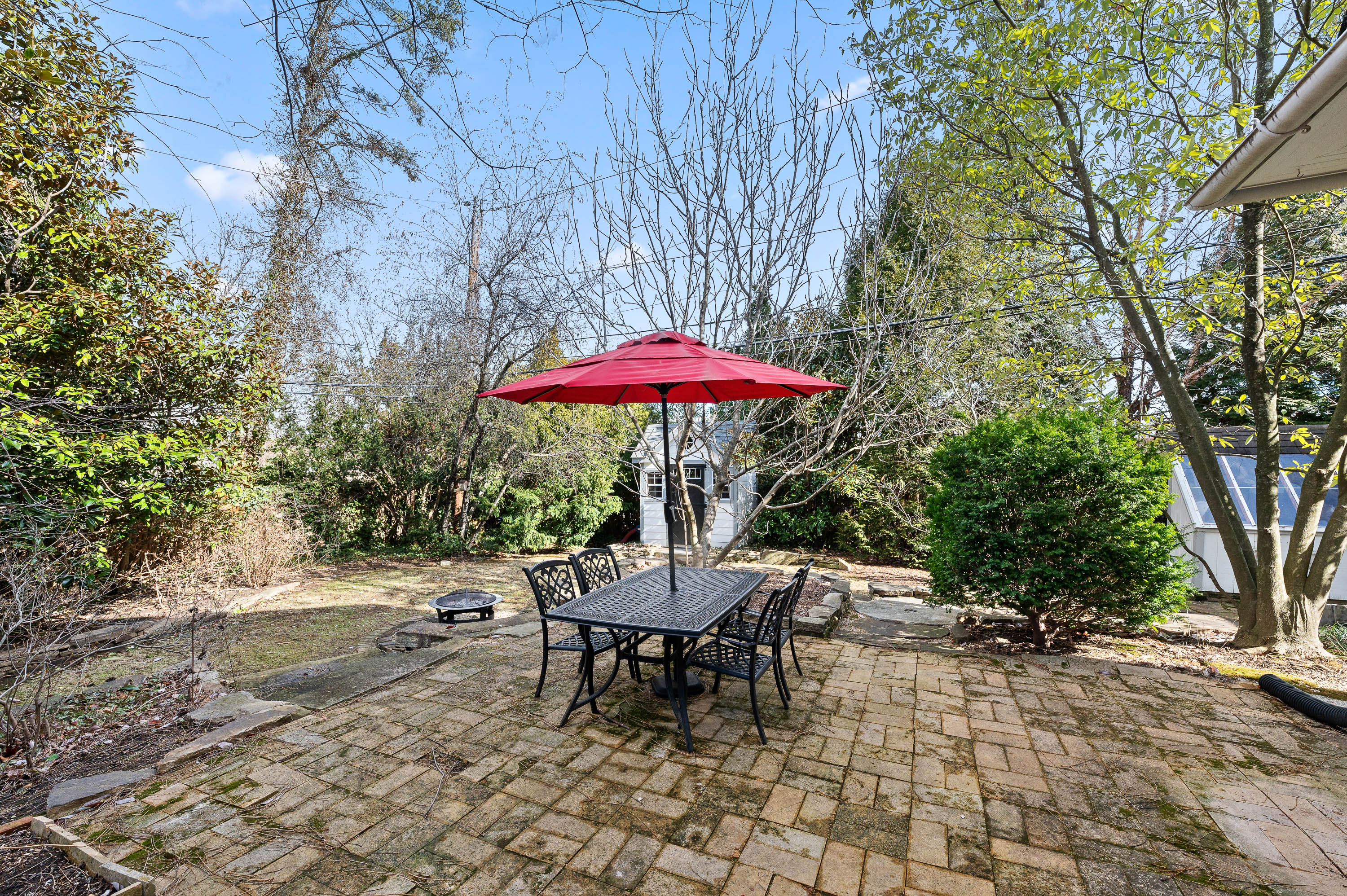 201 West Avenue Wayne, PA 19087 - Photo 21 of 26 a view of a backyard with a patio and fire pit