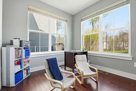 a work room with furniture and windows
