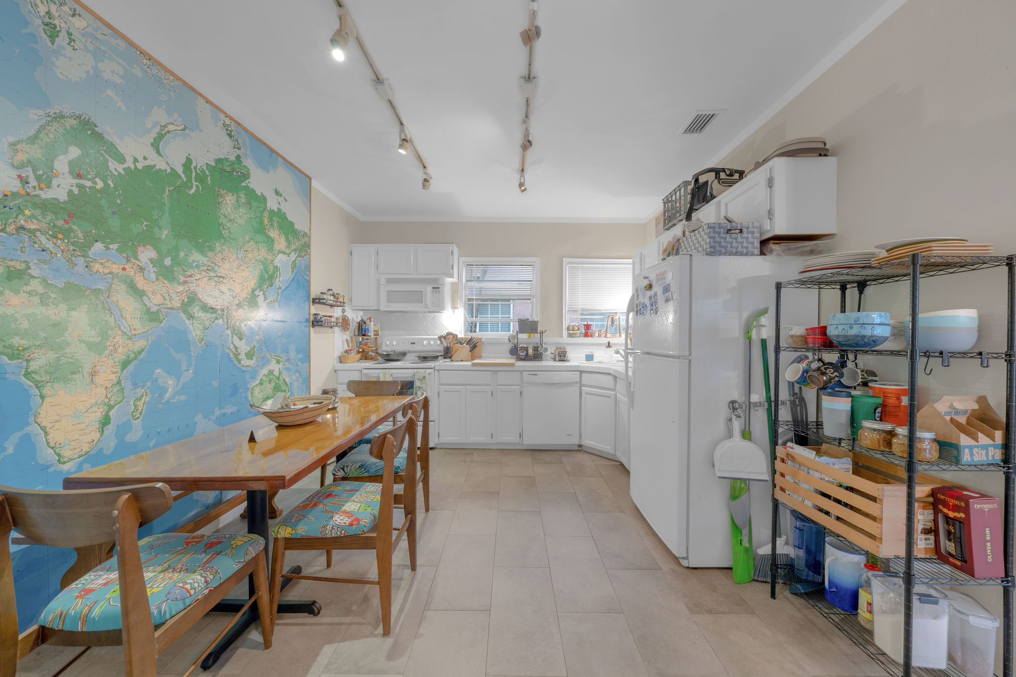 735-745 Meridian Avenue Miami Beach, FL 33139 - Photo 20 of 62 a room with stainless steel appliances kitchen island granite countertop furniture and a refrigerator