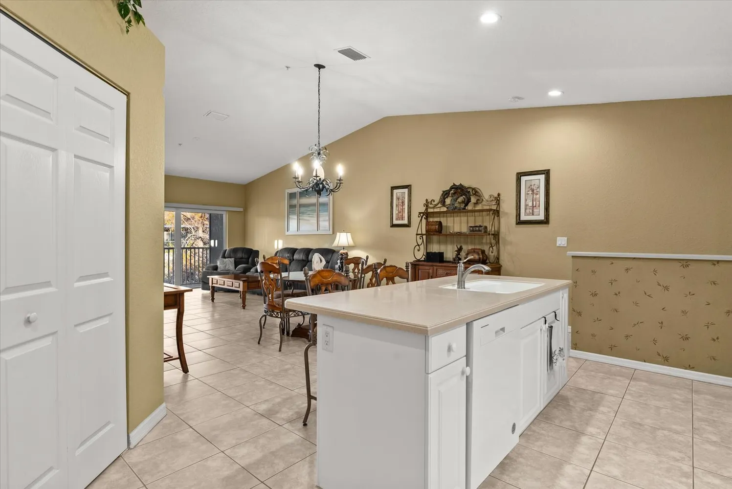 a view of a kitchen area with furniture and chandelier