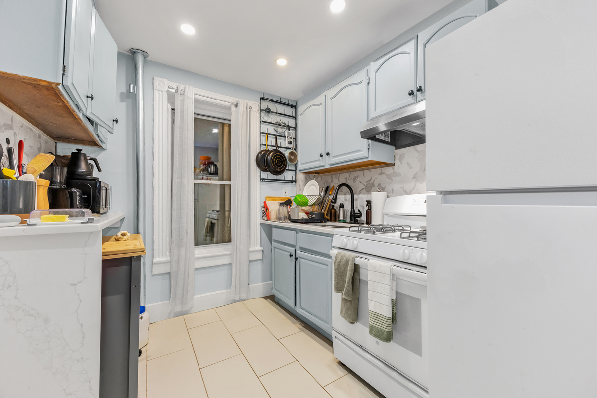 397 Douglass Street Brooklyn, NY 11217 - Photo 7 of 15 a kitchen with stainless steel appliances granite countertop a refrigerator and a sink