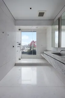 a view of a room with wooden floor and windows