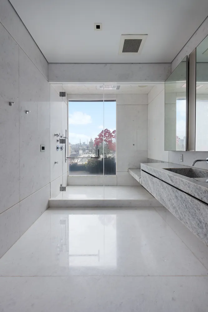 a view of a room with wooden floor and windows