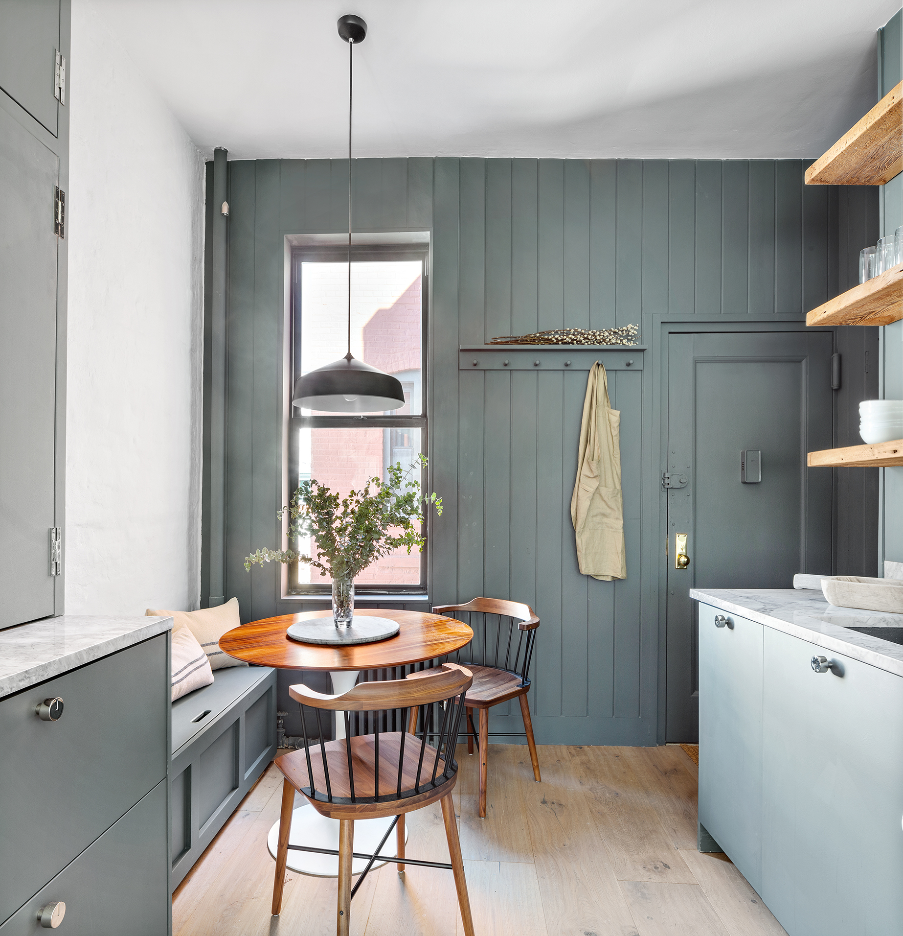 110 Thompson Street, Unit 6E Manhattan, NY 10012 - Photo 2 of 8 a dining room with a window and a table