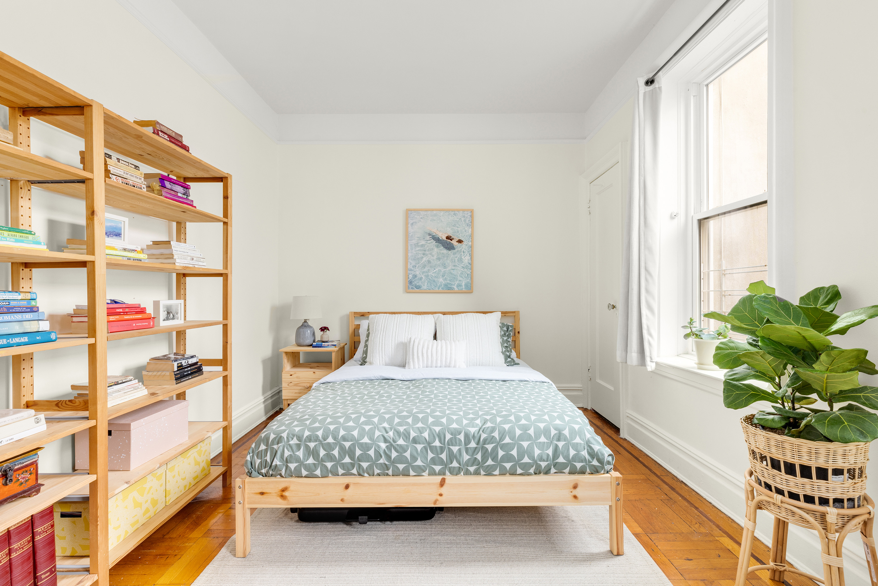 765 42nd Street, Unit 20 Brooklyn, NY 11232 - Photo 4 of 10 a bedroom with a bed table and a window