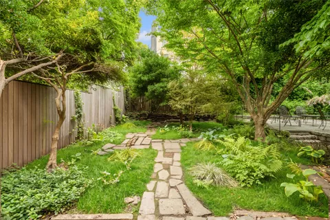 a backyard of a house with lots of green space
