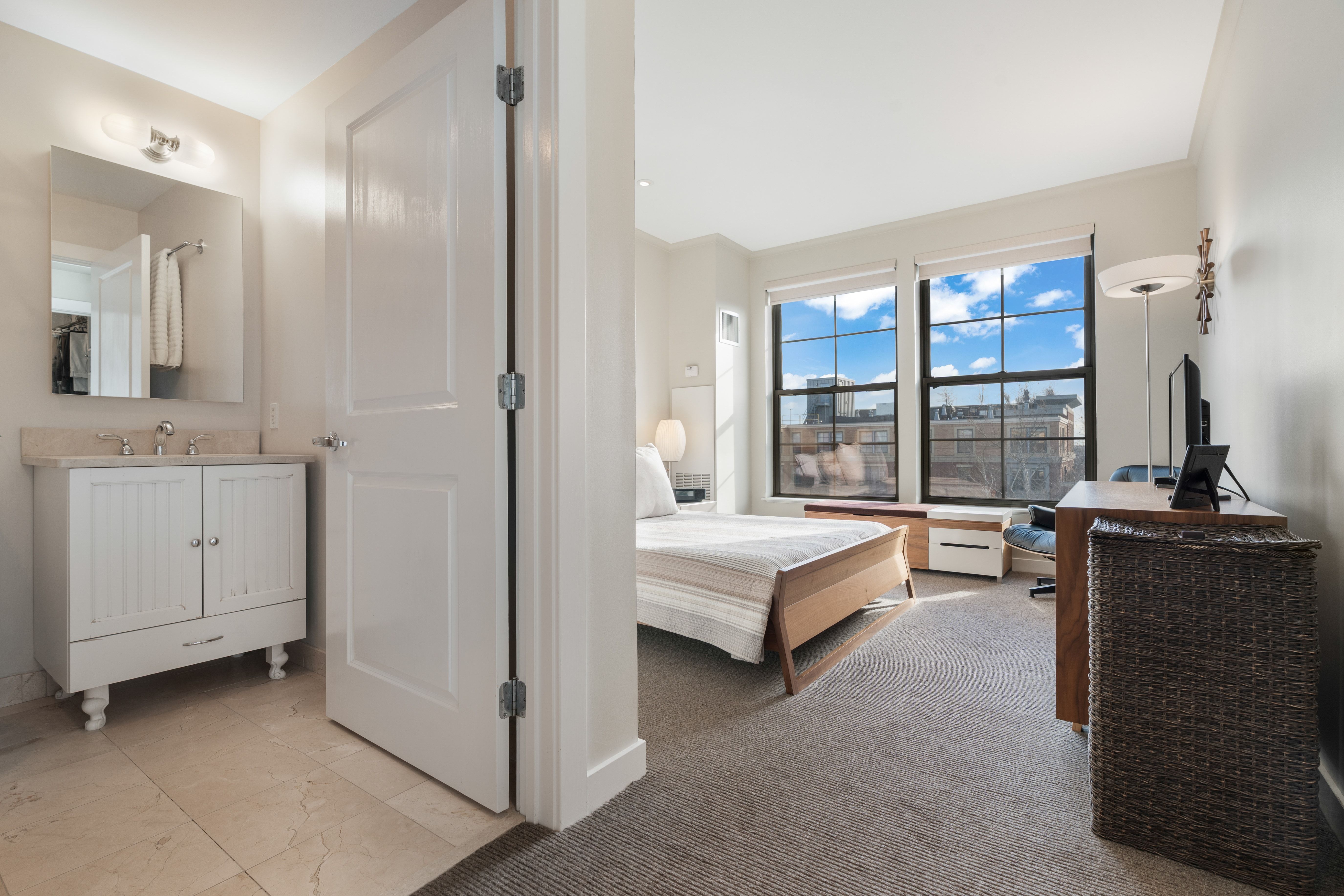 2 Rollins Street, Unit D601 Boston, MA 02118 - Photo 21 of 29 a spacious bedroom with a bed and a dresser