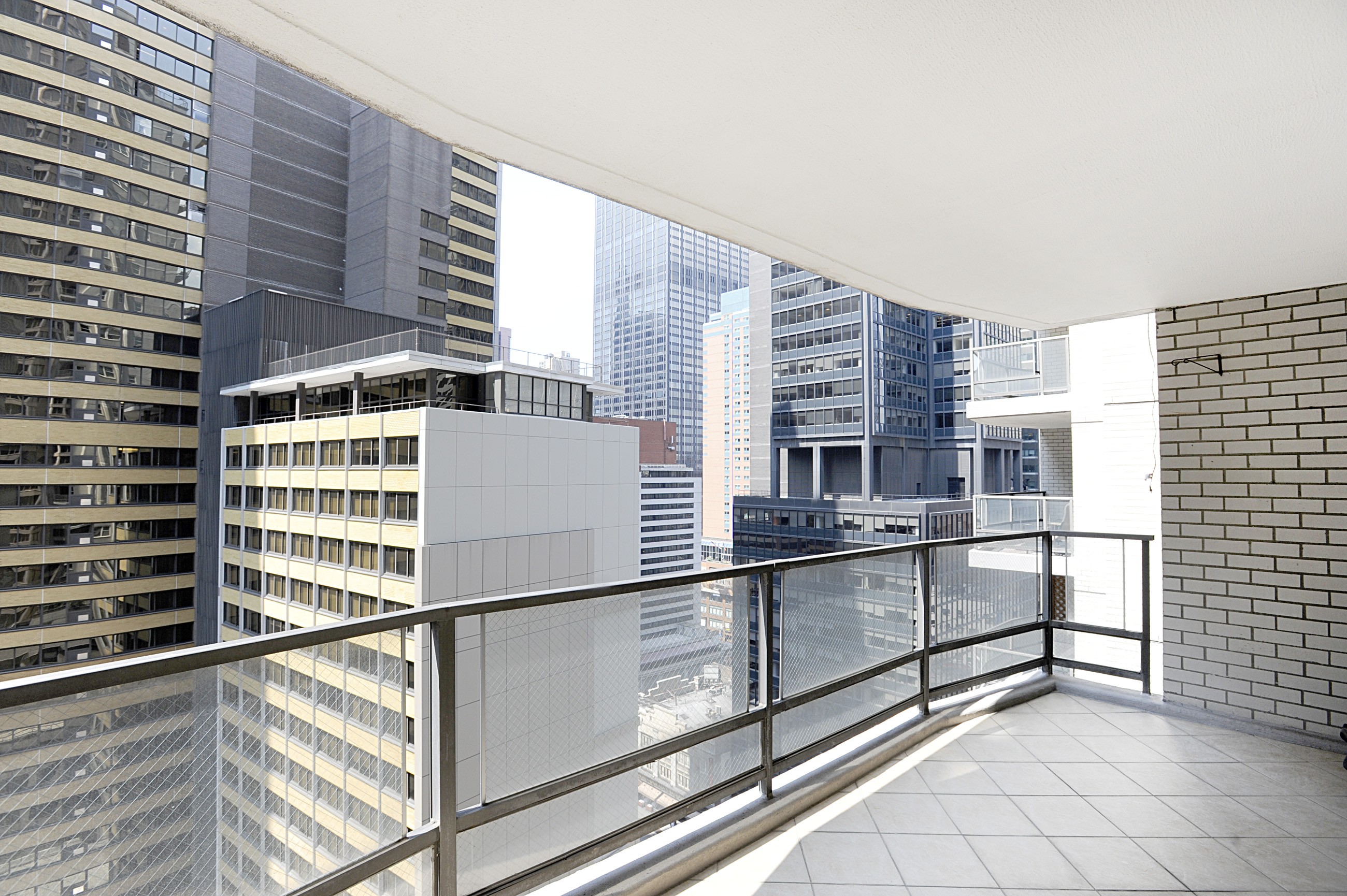 159 West 53rd Street, Unit 18B Manhattan, NY 10019 - Photo 1 of 11 a view of kitchen and microwave