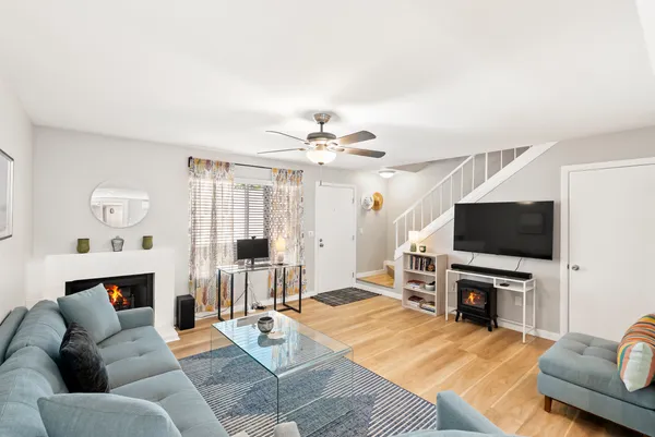 a living room with furniture and a flat screen tv