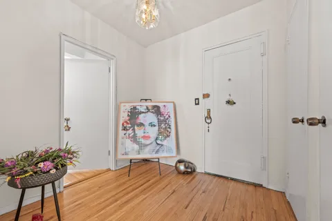 a view of room with painting on the wall