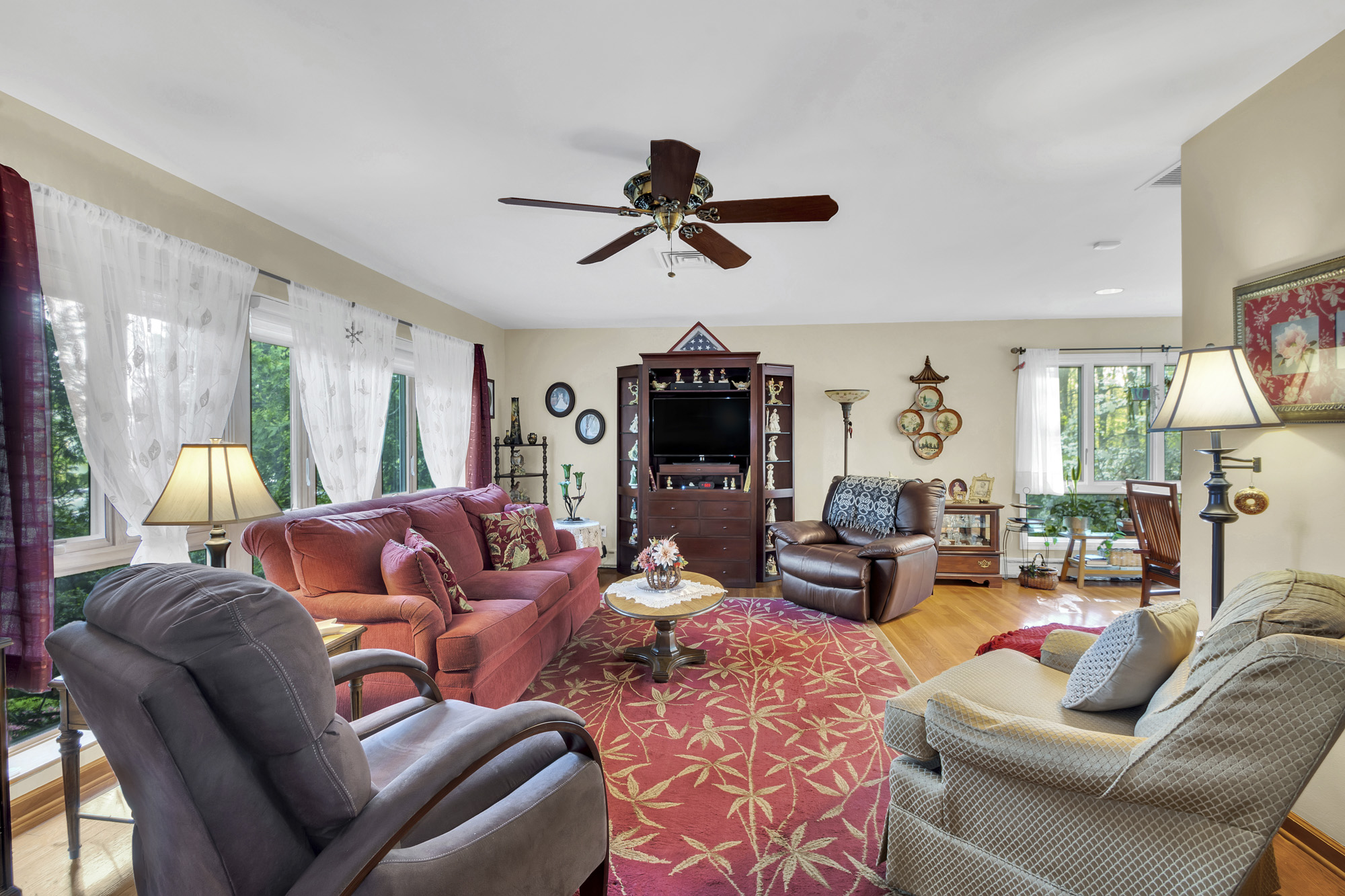 131 Jansen Street Staten Island, NY 10312 - Photo 2 of 21 a living room with furniture a ceiling fan and a window