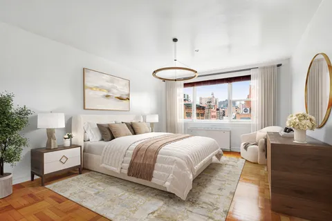 a bedroom with a large bed and a window