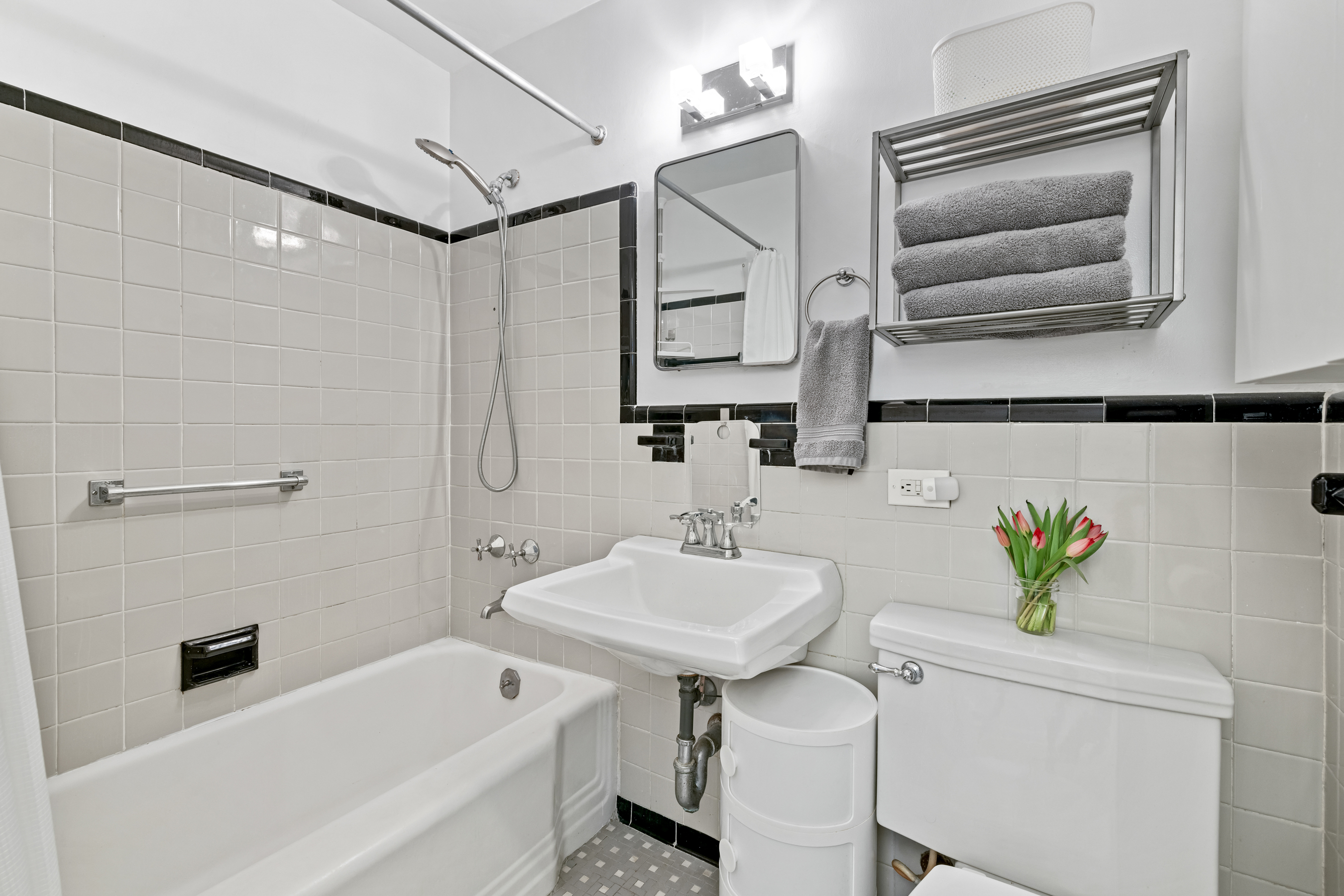 2727 Palisade Avenue, Unit 3H Bronx, NY 10463 - Photo 10 of 18 a bathroom with a sink and a mirror