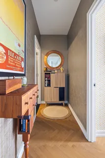 a bedroom with a bed and glass window