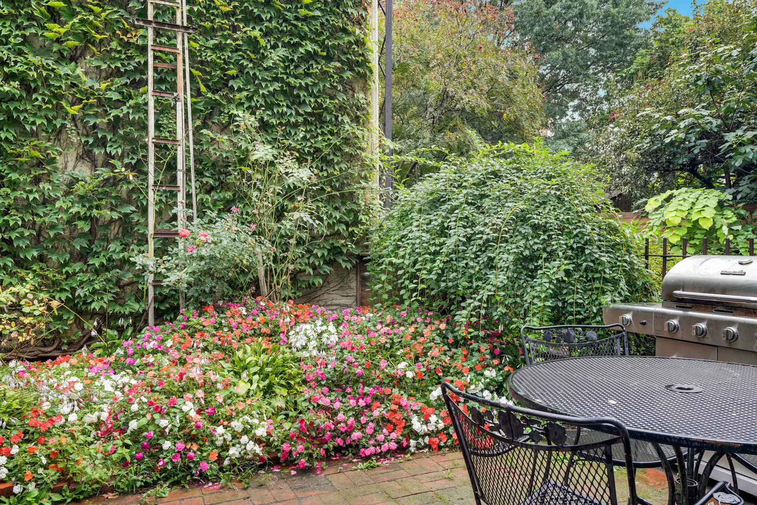 a view of a chairs and table in the patio