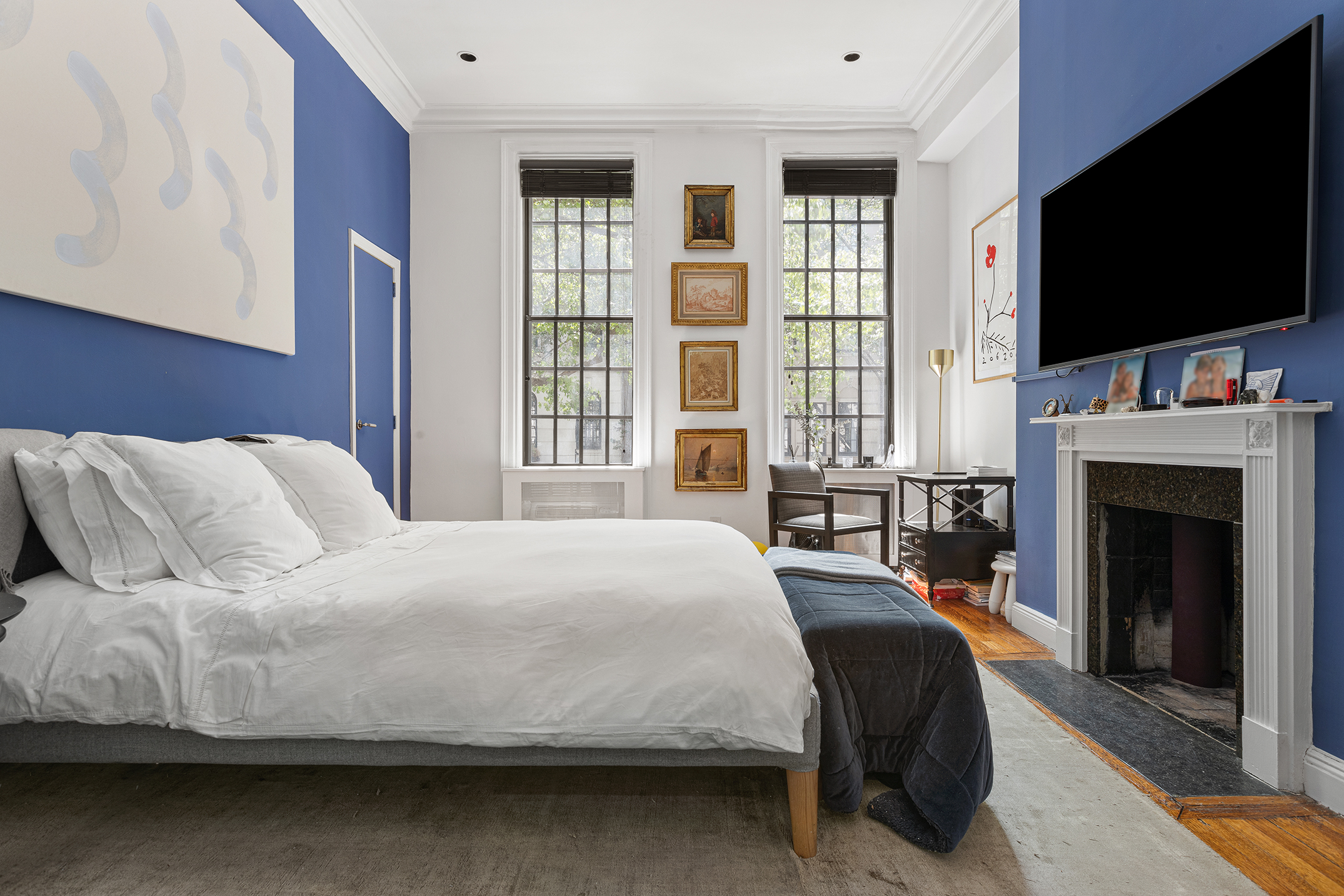 159 East 63rd Street, Unit 2/3 Manhattan, NY 10065 - Photo 7 of 13 a bedroom with a bed and a flat screen tv
