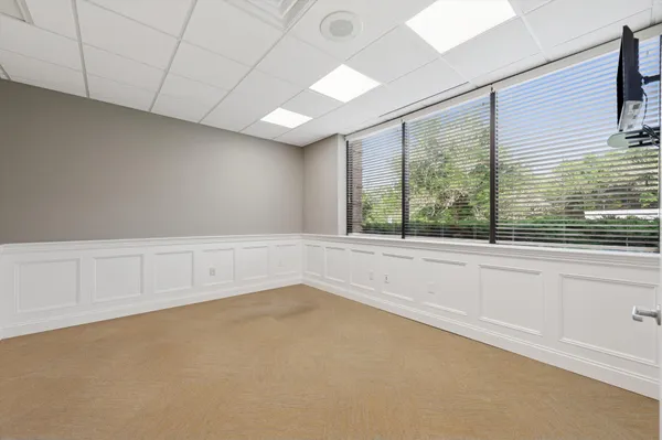 a view of an empty room with a window