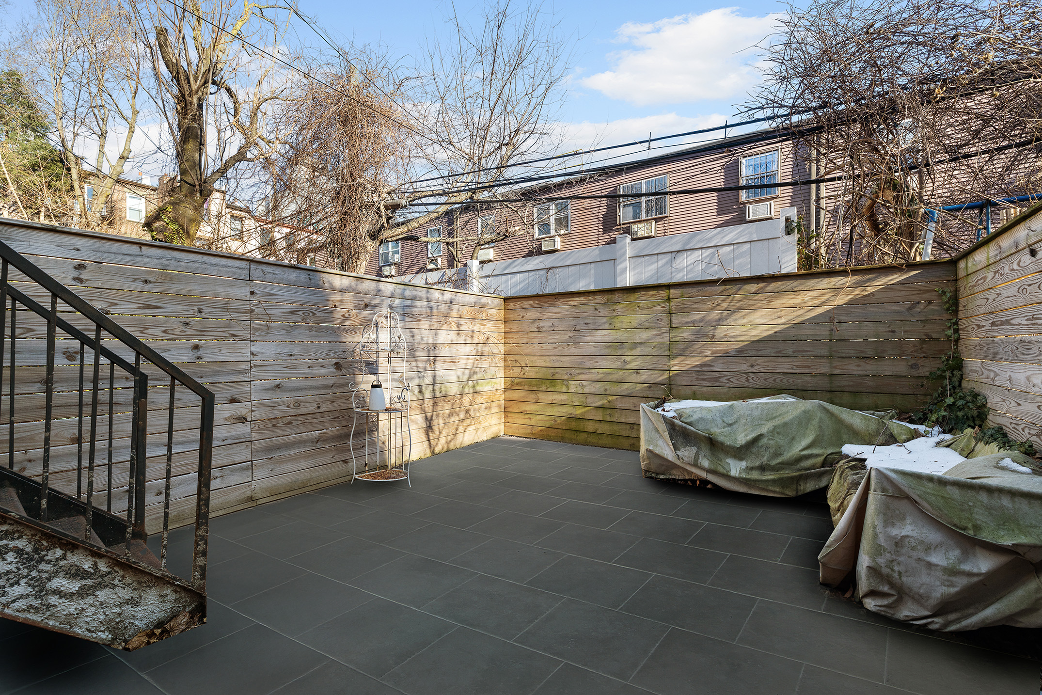 34 Woodbine Street Brooklyn, NY 11221 - Photo 11 of 15 a view of a car park in front of house