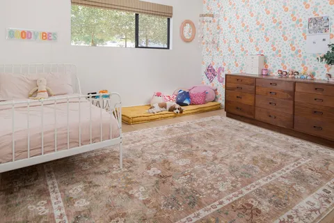 a bed room with a bed and a window