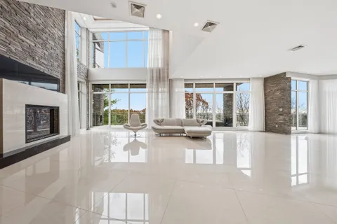 a view of living room with furniture and floor to ceiling window
