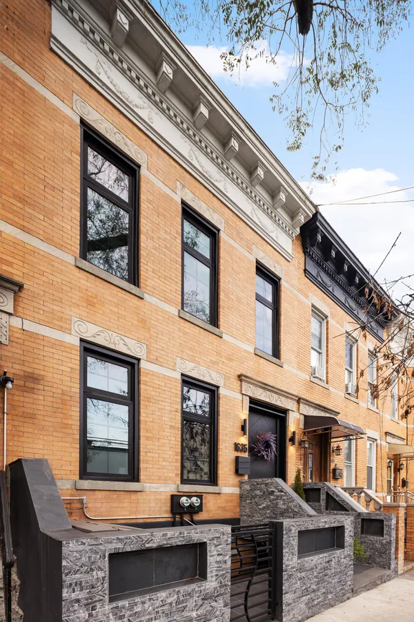 a front view of a building with large windows