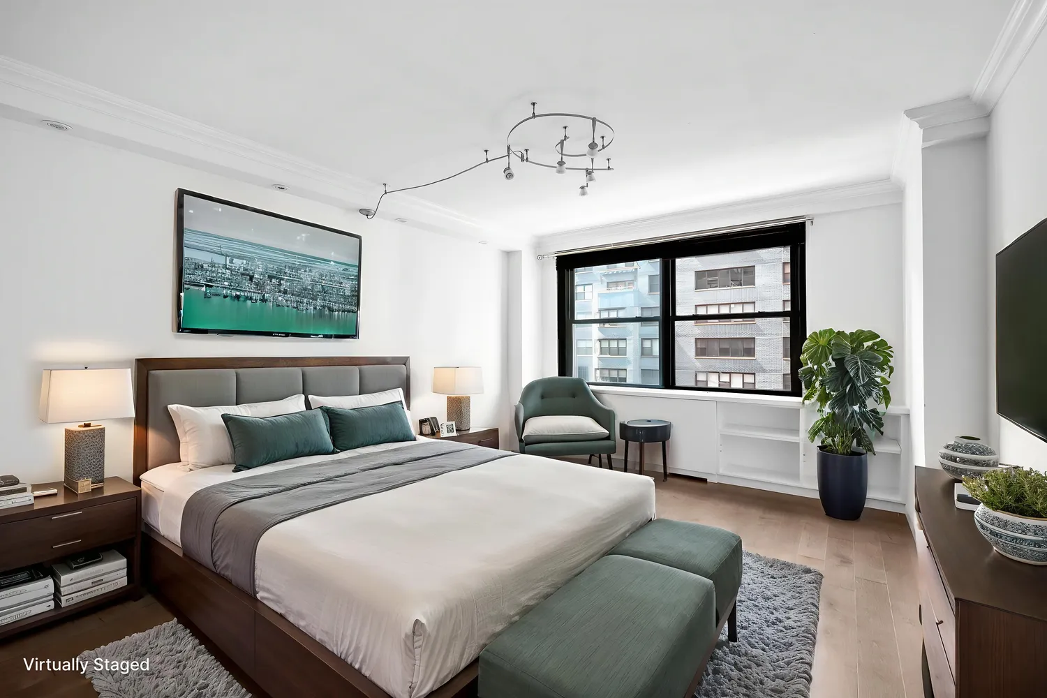 a bedroom with furniture and a large window