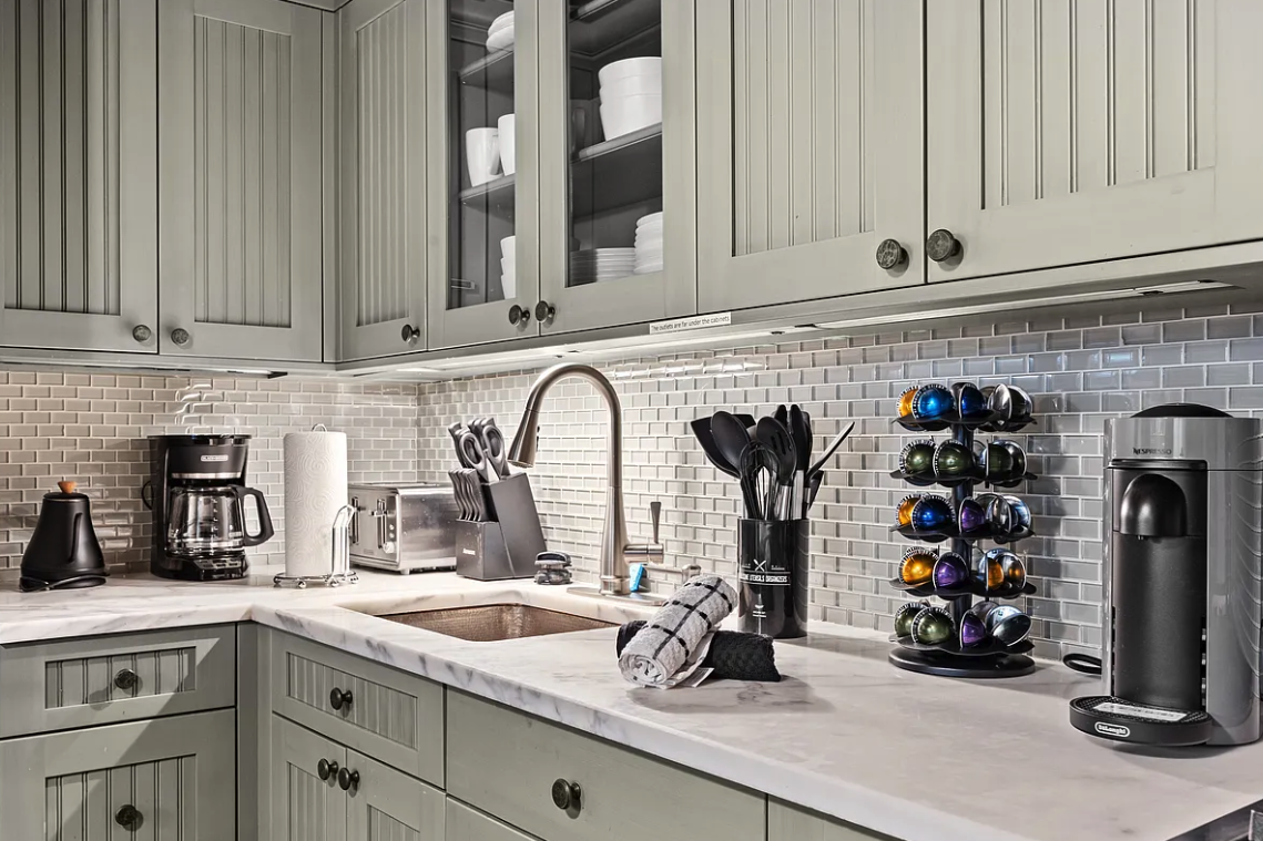 58 Downing Street Manhattan, NY 10014 - Photo 7 of 21 a kitchen with sink and cabinets